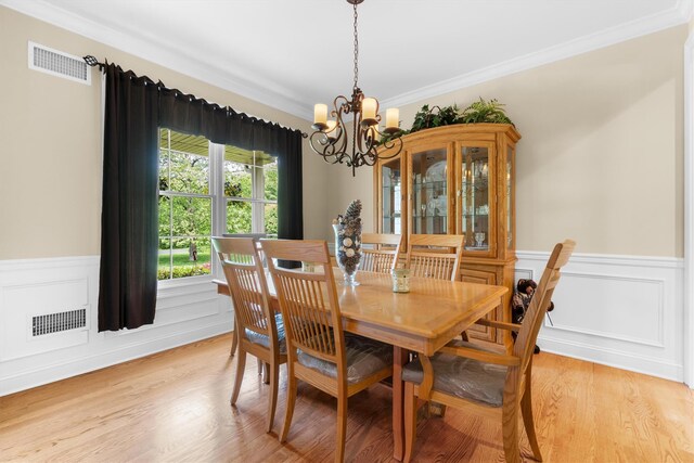 1 Hidden Hills Ct, Warwick, NY 10990 - dining space with a chandelier, crown molding, wainscoting, and light wood-style floors