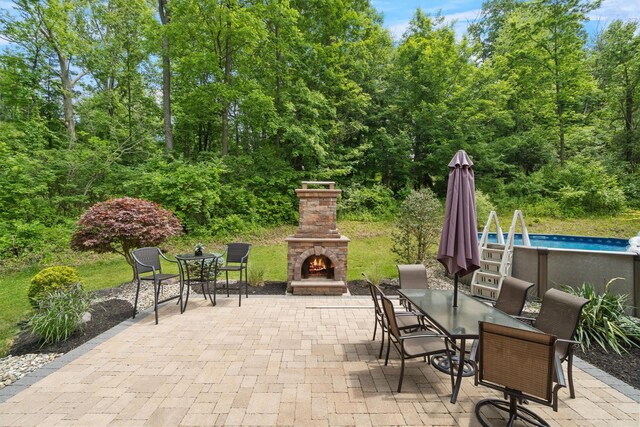 1 Hidden Hills Ct, Warwick, NY 10990 - view of patio / terrace featuring an outdoor stone fireplace, outdoor dining area, and an outdoor pool