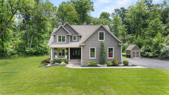 1 Hidden Hills Ct, Warwick, NY 10990 - view of front of house with covered porch, an outbuilding, a garage, and a front lawn