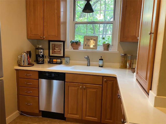 1360 Midland Ave Unit 1B, Bronxville, NY 10708 - kitchen with stainless steel dishwasher, light countertops, and brown cabinets