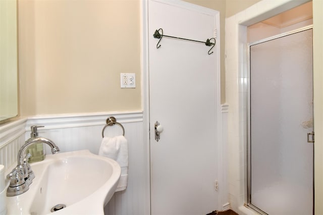 1360 Midland Ave Unit 1B, Bronxville, NY 10708 - full bathroom featuring wainscoting and a shower stall