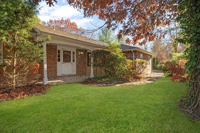 175 Laurel Ln, Laurel Hollow, NY 11791 - back of property featuring brick siding, a yard, and roof with shingles