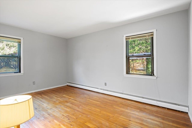 175 Laurel Ln, Laurel Hollow, NY 11791 - empty room featuring a baseboard radiator and light wood-style floors