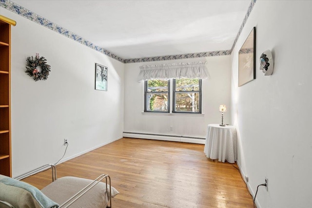 175 Laurel Ln, Laurel Hollow, NY 11791 - sitting room featuring a baseboard radiator and light wood-style floors