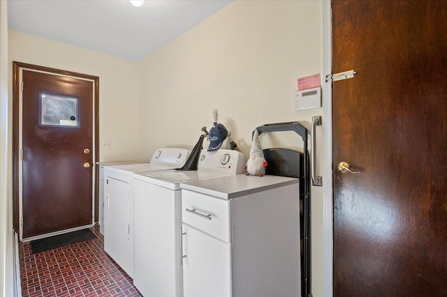 175 Laurel Ln, Laurel Hollow, NY 11791 - washroom featuring washing machine and dryer, cabinet space, and brick patterned flooring