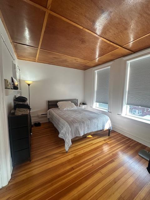 457 Main St Apt 5, Beacon, NY 12508 - bedroom with wood finished floors, wooden ceiling, and baseboard heating