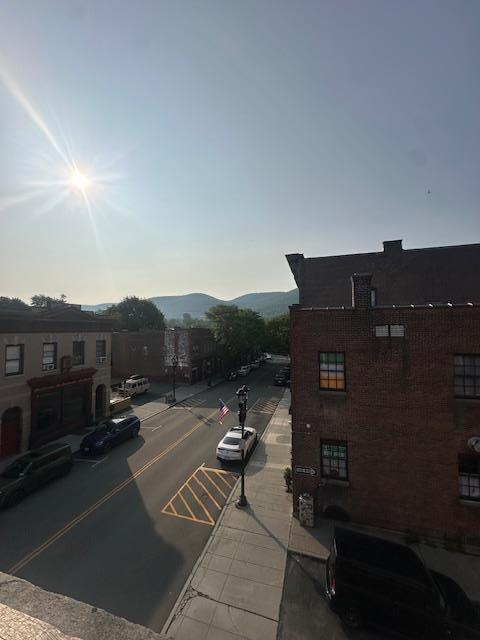 457 Main St Apt 5, Beacon, NY 12508 - view of asphalt road featuring sidewalks, curbs, and a mountain view