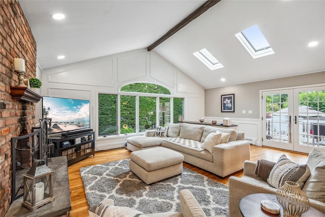 86 Phipps Ln, Plainview, NY 11803 - living area with a decorative wall, a skylight, light wood-style flooring, french doors, and a baseboard radiator