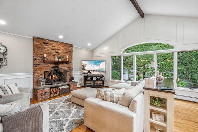 86 Phipps Ln, Plainview, NY 11803 - living area featuring a decorative wall, wood finished floors, baseboard heating, a fireplace, and a wainscoted wall