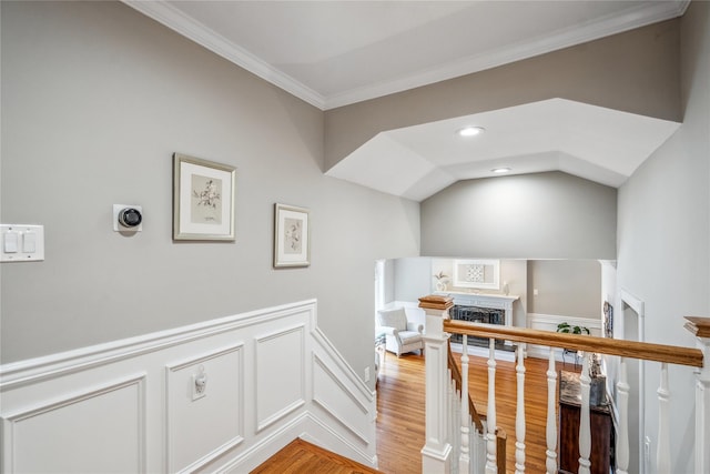 86 Phipps Ln, Plainview, NY 11803 - hall with light wood-type flooring, crown molding, and a wainscoted wall