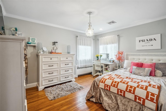 86 Phipps Ln, Plainview, NY 11803 - bedroom with radiator heating unit, ornamental molding, light wood-style floors, and recessed lighting