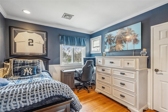 86 Phipps Ln, Plainview, NY 11803 - bedroom with light wood finished floors, ornamental molding, wainscoting, and a desk