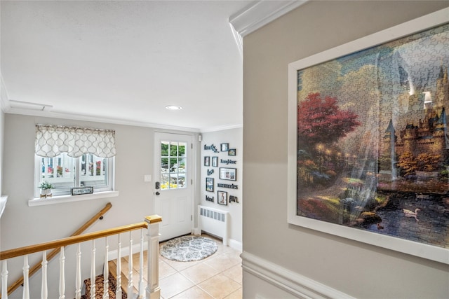 86 Phipps Ln, Plainview, NY 11803 - foyer with radiator heating unit, light tile patterned flooring, ornamental molding, and recessed lighting