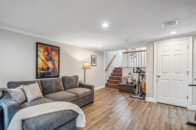86 Phipps Ln, Plainview, NY 11803 - living area featuring crown molding, light wood-type flooring, stairway, and recessed lighting