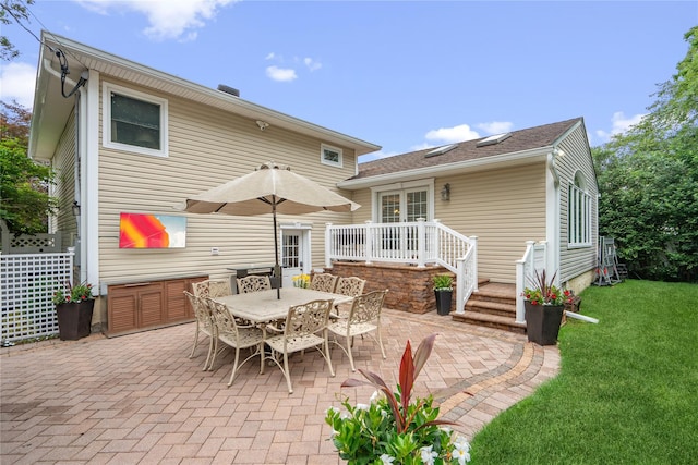 86 Phipps Ln, Plainview, NY 11803 - rear view of house featuring a patio area, a yard, and outdoor dining area