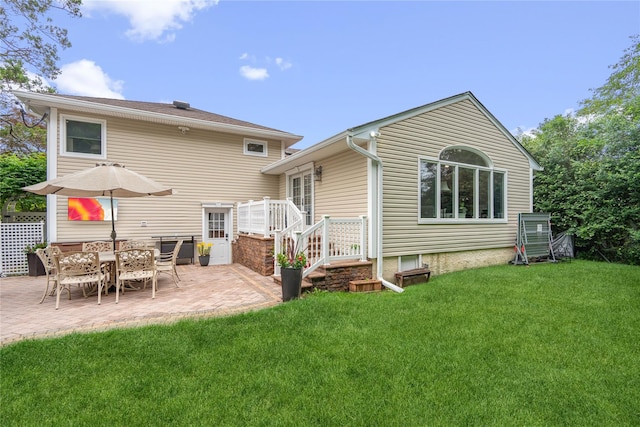 86 Phipps Ln, Plainview, NY 11803 - back of property featuring a lawn and a patio