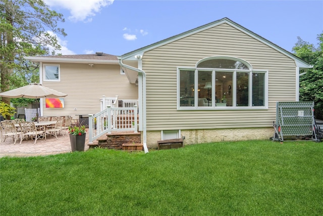 86 Phipps Ln, Plainview, NY 11803 - back of house with a patio and a lawn