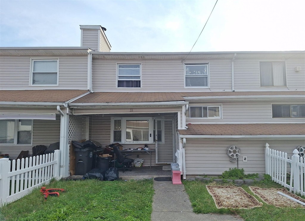 33 Marc St, Staten Island, NY 10314 - townhome / multi-family property featuring a chimney and a patio