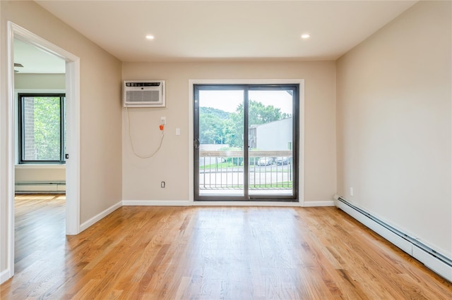 255 Country Club Ln, Pomona, NY 10970 - unfurnished room with a baseboard heating unit, light wood-style floors, a wall mounted AC, and recessed lighting