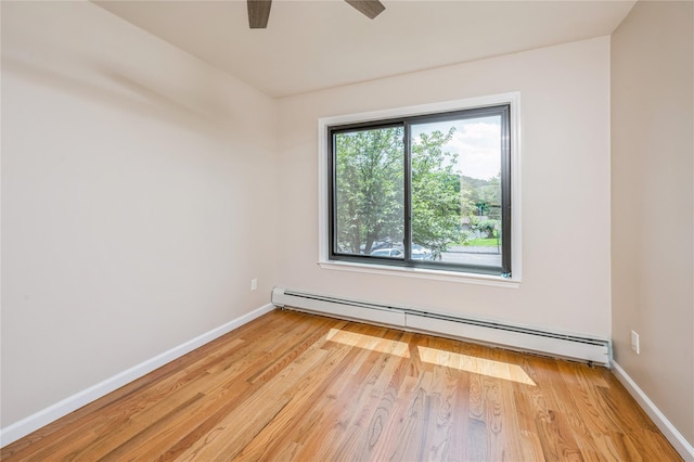 255 Country Club Ln, Pomona, NY 10970 - unfurnished room with baseboard heating, light wood-style floors, and a ceiling fan