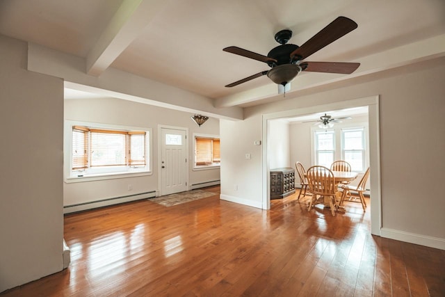 19 Harper Ave, Montrose, NY 10548 - living room with a baseboard heating unit, a baseboard radiator, a ceiling fan, beamed ceiling, and hardwood / wood-style floors