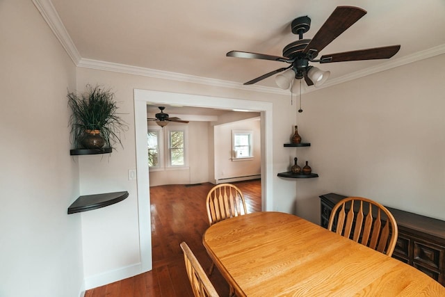 19 Harper Ave, Montrose, NY 10548 - dining room with a baseboard heating unit, ornamental molding, ceiling fan, and dark wood finished floors