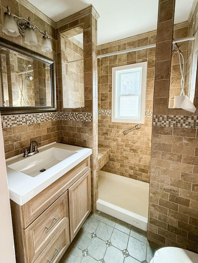 19 Harper Ave, Montrose, NY 10548 - bathroom with tiled shower, tile walls, vanity, and tile patterned flooring