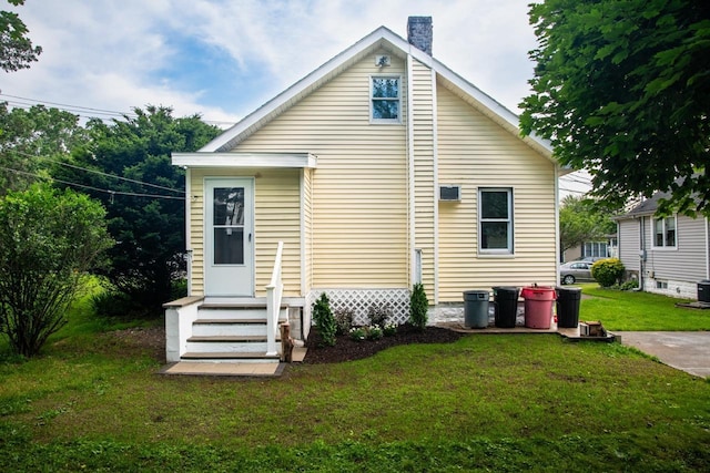 19 Harper Ave, Montrose, NY 10548 - rear view of property with a chimney, a yard, and entry steps
