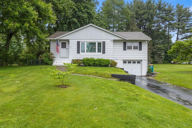 29 Chestnut St, Poughkeepsie, NY 12601 - single story home featuring asphalt driveway, a garage, roof with shingles, and a front lawn