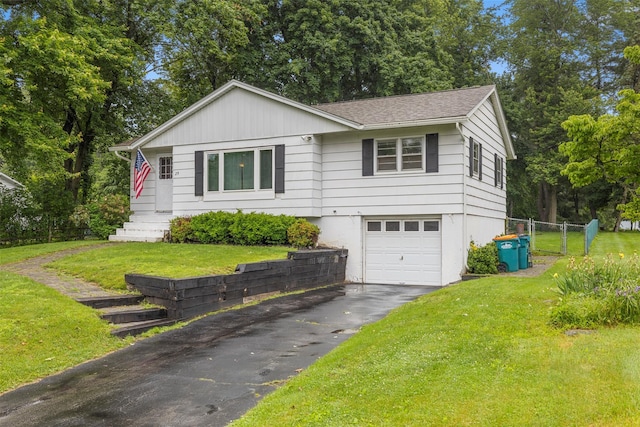 29 Chestnut St, Poughkeepsie, NY 12601 - single story home with asphalt driveway, an attached garage, a shingled roof, and view of scattered trees