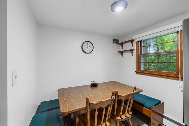 29 Chestnut St, Poughkeepsie, NY 12601 - dining area with a baseboard heating unit