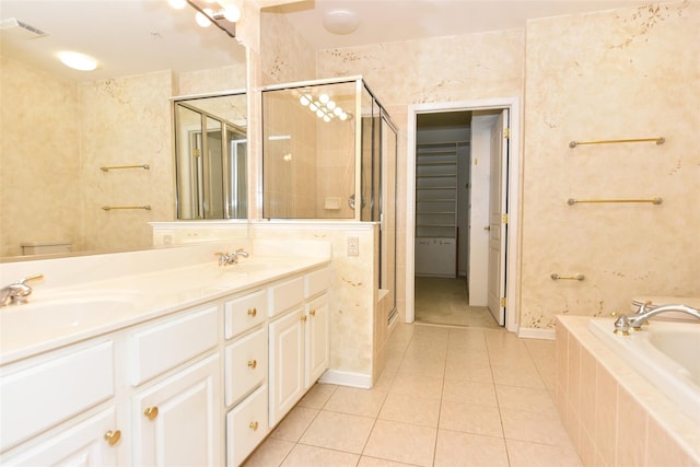 30 N De Baun Ave N Unit 208, Suffern, NY 10901 - bathroom with tile patterned floors, a shower stall, a garden tub, double vanity, and a closet