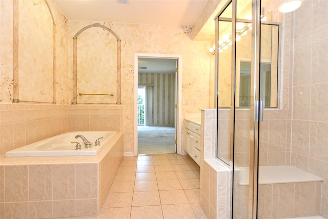 30 N De Baun Ave N Unit 208, Suffern, NY 10901 - bathroom featuring a garden tub, vanity, tile patterned flooring, a stall shower, and wallpapered walls