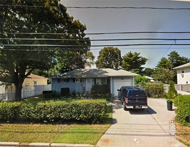 127 New Jersey Ave, Bay Shore, NY 11706 - view of front of property featuring concrete driveway and an attached garage
