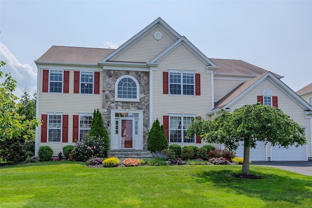 9 Avolet Ct, Mount Sinai, NY 11766 - colonial home with a front lawn, stone siding, and asphalt driveway