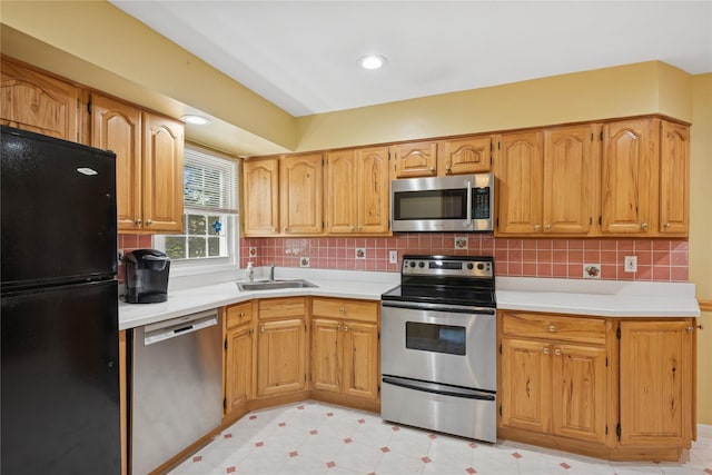 6 Grey Rock Ct, Bethpage, NY 11714 - kitchen with appliances with stainless steel finishes, decorative backsplash, and light countertops