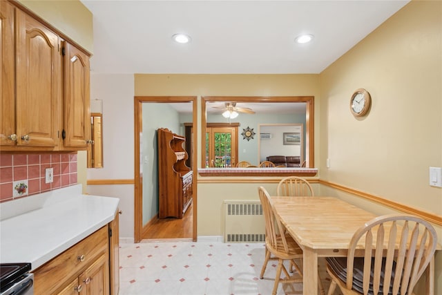 6 Grey Rock Ct, Bethpage, NY 11714 - kitchen with ceiling fan, light countertops, backsplash, radiator, and electric range