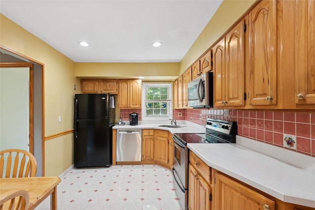 6 Grey Rock Ct, Bethpage, NY 11714 - kitchen with stainless steel appliances, light flooring, light countertops, backsplash, and brown cabinets