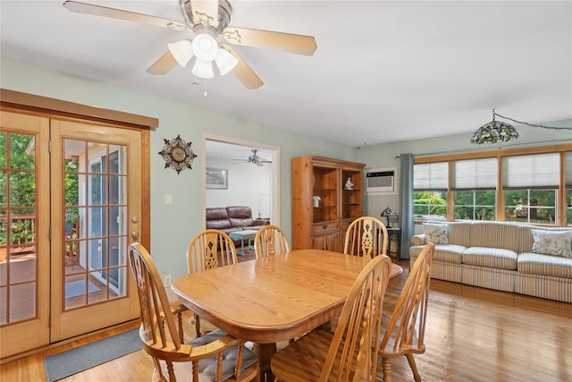 6 Grey Rock Ct, Bethpage, NY 11714 - dining area with light wood-style flooring, ceiling fan, and a wall mounted air conditioner