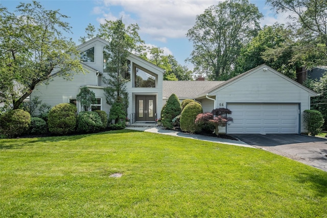 64 Highland Ave, Roslyn, NY 11576 - mid-century modern home featuring french doors, asphalt driveway, an attached garage, and a front lawn