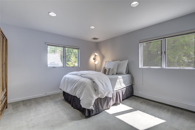 64 Highland Ave, Roslyn, NY 11576 - bedroom with recessed lighting and light carpet
