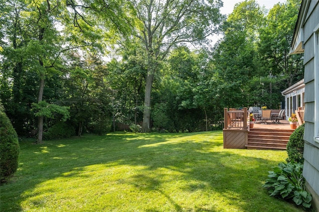 64 Highland Ave, Roslyn, NY 11576 - view of grassy yard with a wooden deck and outdoor dining space