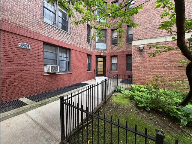 65-39 108th St Unit E6, Forest Hills, NY 11375 - view of home's exterior featuring brick siding and cooling unit