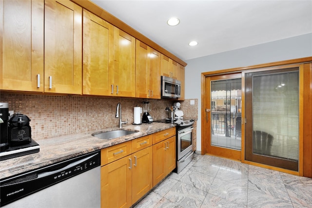 2616 Brown St, Brooklyn, NY 11235 - kitchen featuring stainless steel appliances, light stone counters, light marble finish floors, decorative backsplash, and recessed lighting