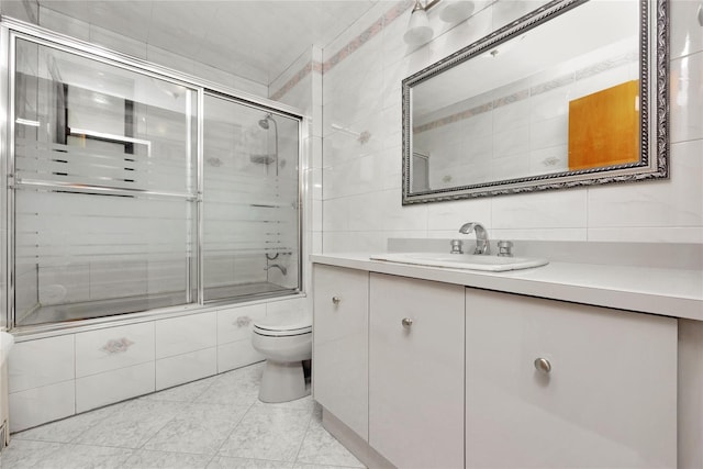2616 Brown St, Brooklyn, NY 11235 - bathroom with tile walls, tiled shower / bath, vanity, tile patterned flooring, and decorative backsplash