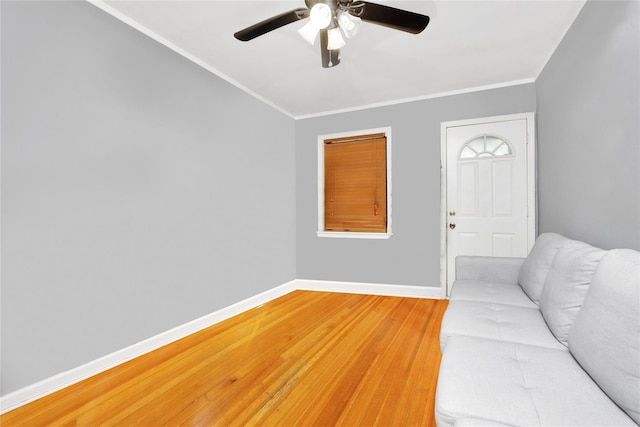 2616 Brown St, Brooklyn, NY 11235 - unfurnished living room featuring light wood-type flooring, ceiling fan, and ornamental molding