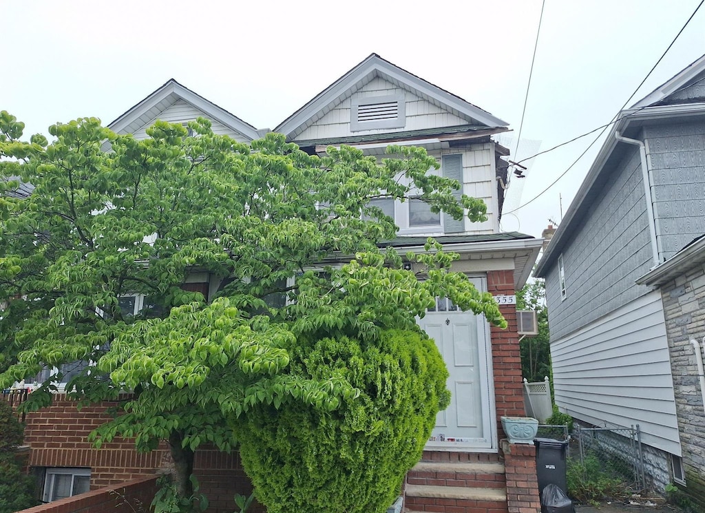 13-55 57th St E, Brooklyn, NY 11234 - view of front of home with entry steps and brick siding