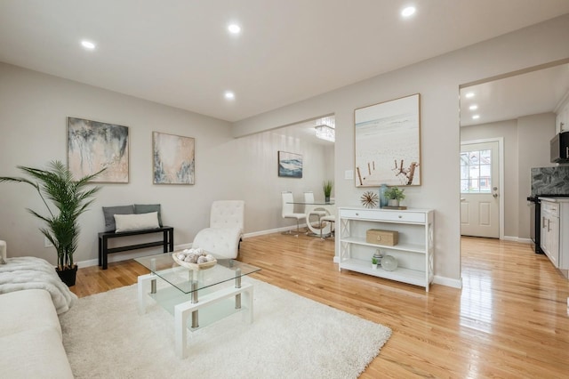 1086 Lehman Rd, West Hempstead, NY 11552 - living room with light wood finished floors and recessed lighting