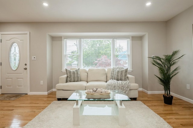 1086 Lehman Rd, West Hempstead, NY 11552 - living area featuring light wood finished floors, healthy amount of natural light, and recessed lighting