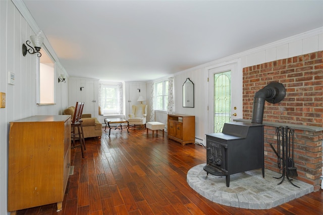 591 Hillside Lake Rd, Wappingers Falls, NY 12590 - living area featuring a wood stove, dark wood-style floors, and ornamental molding